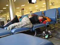 We pushed together a bunch of benches to make an awesome king size bed in the Atlanta airport. (Category:  Travel)