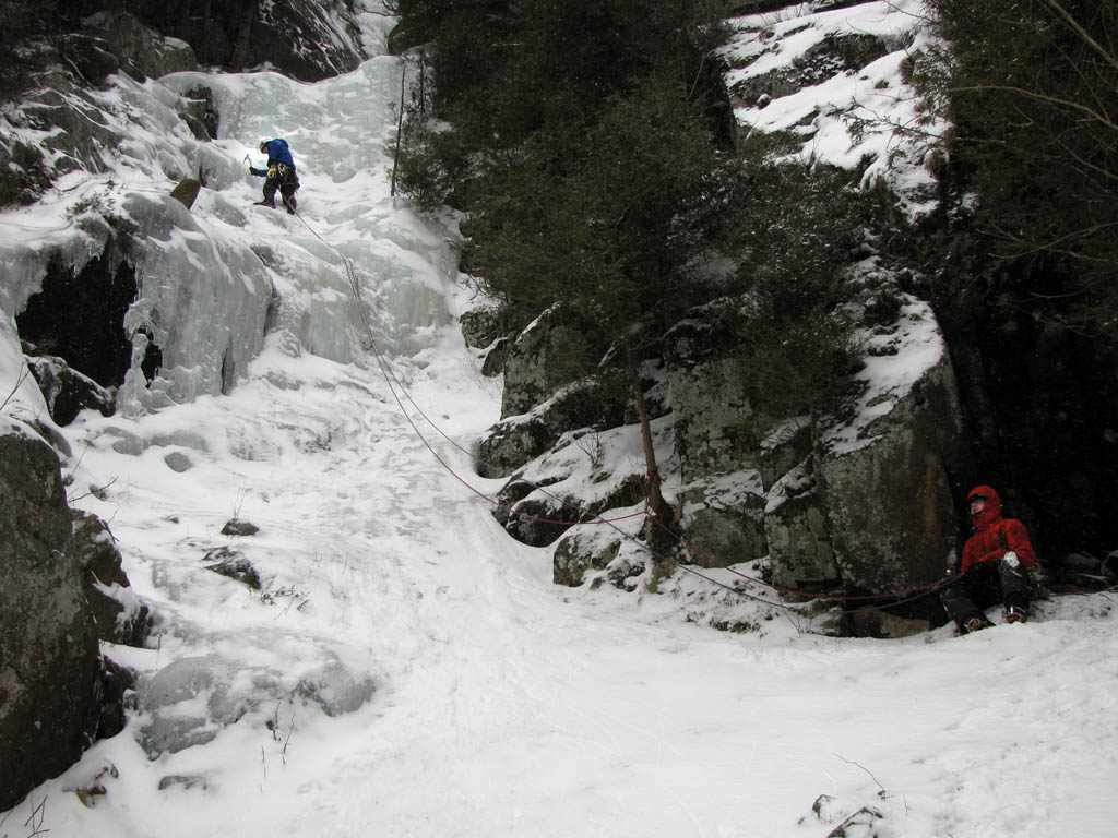 Guy climbing, Mike belaying. (Category:  Ice Climbing)