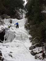 Guy at the vertical section of the first pitch. (Category:  Ice Climbing)