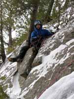 Guy belaying at the top of the second pitch. (Category:  Ice Climbing)
