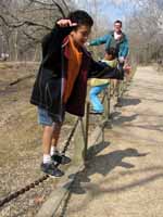 Nassor, Sophia and me slacklining. (Category:  Camping)