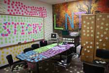 The conference room.  Leave no trace of a surface uncovered by stickies. (Category:  Party)