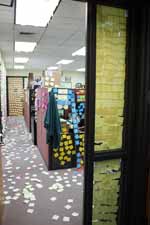The post-its on the floor are sticky side up.  Makes walking difficult. (Category:  Party)