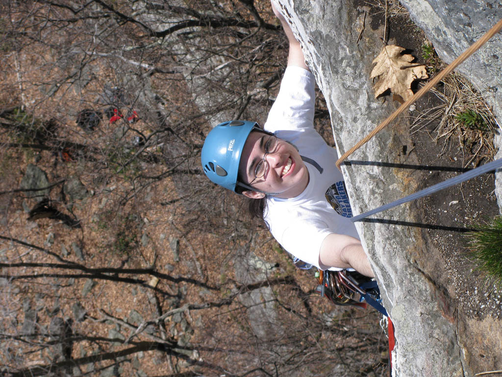 Melissa reaching the top of Andrew. (Category:  Rock Climbing)