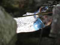 Melissa in the Updraft squeeze chimney. (Category:  Rock Climbing)