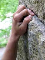 Melissa latching the deadpoint to the first hold on Red Cabbage Right. (Category:  Rock Climbing)