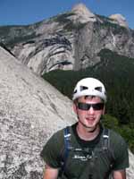 Guy at the top of The Grack.  Royal Arches, Washington Column and North Dome are all visible in the background. (Category:  Rock Climbing)