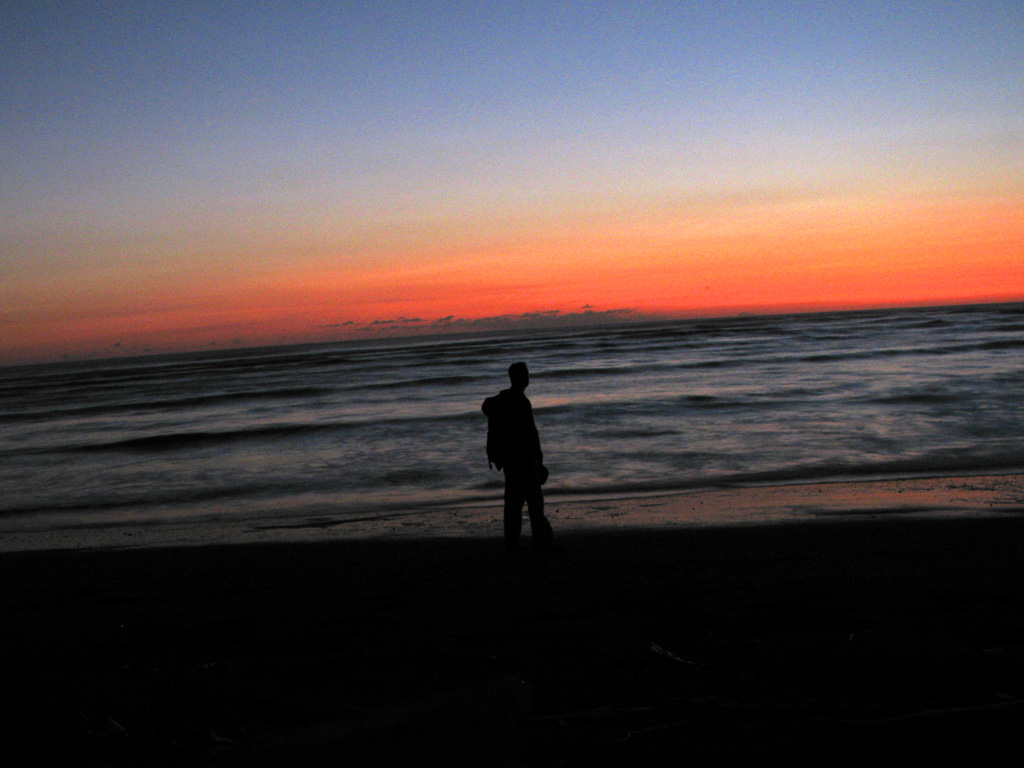 Self portrait taken during the very last bit of sunset over the Pacific Ocean. (Category:  Travel)