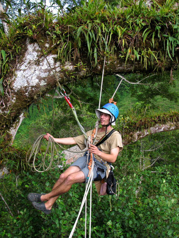 Dave trying to remove the old static line.  He has unthreaded the girth hitch and is putting body weight on the rope.  It won't move. (Category:  Travel)