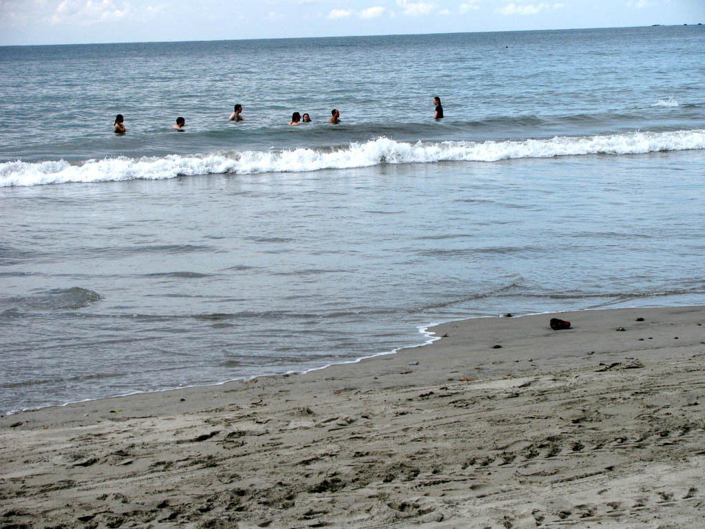 Playing in the ocean. (Category:  Travel)