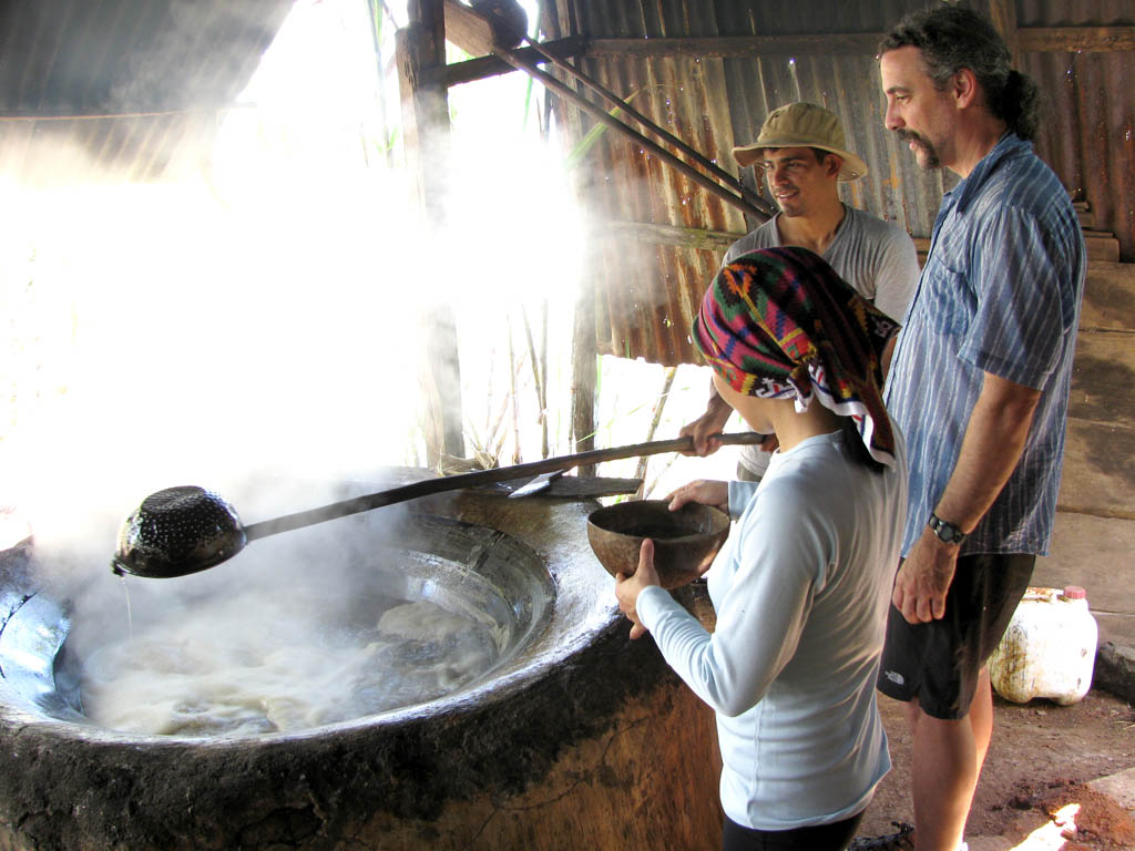 Regie, Rolando and Mark cooking sugar. (Category:  Travel)