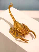 Gold scorpion. (Category:  Travel)