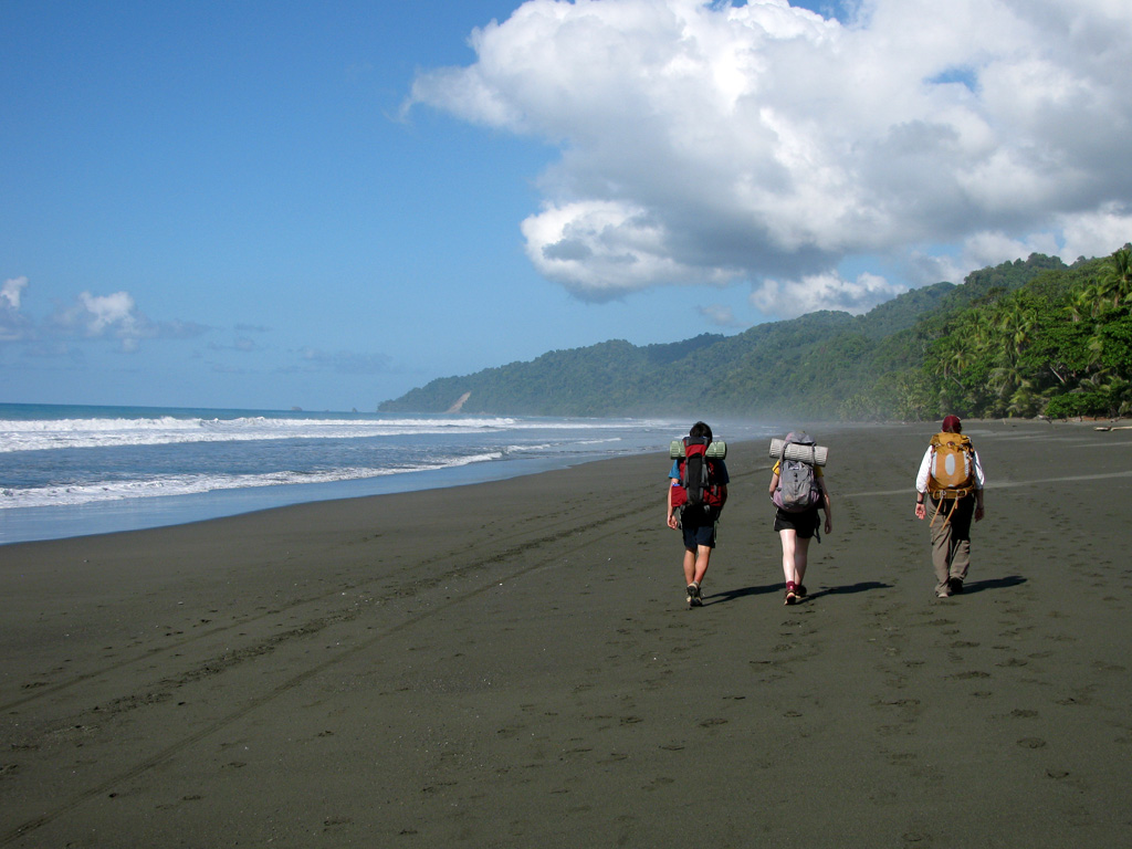 Joe, Alex and Jess hiking along the beach. (Category:  Travel)