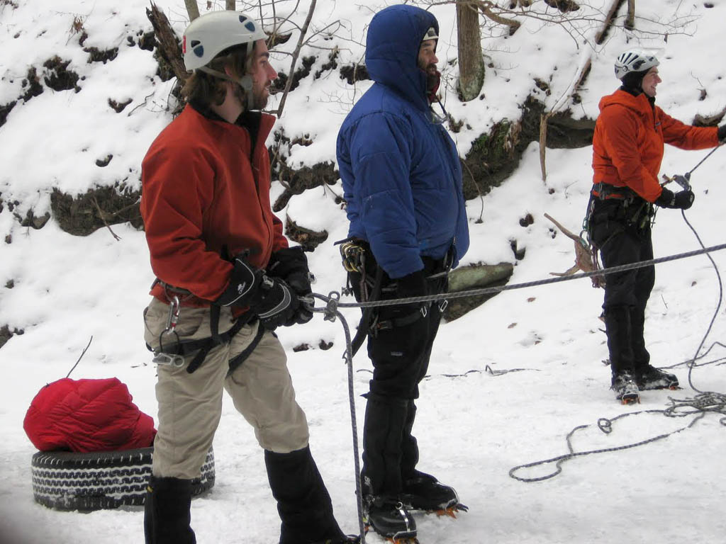 Bunch of belayers at the... ummm... is that spare tire?  At Lick Brook?  Who does that? (Category:  Ice Climbing)