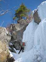 Placing a screw. (Category:  Ice Climbing)