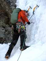 Placing a screw. (Category:  Ice Climbing)