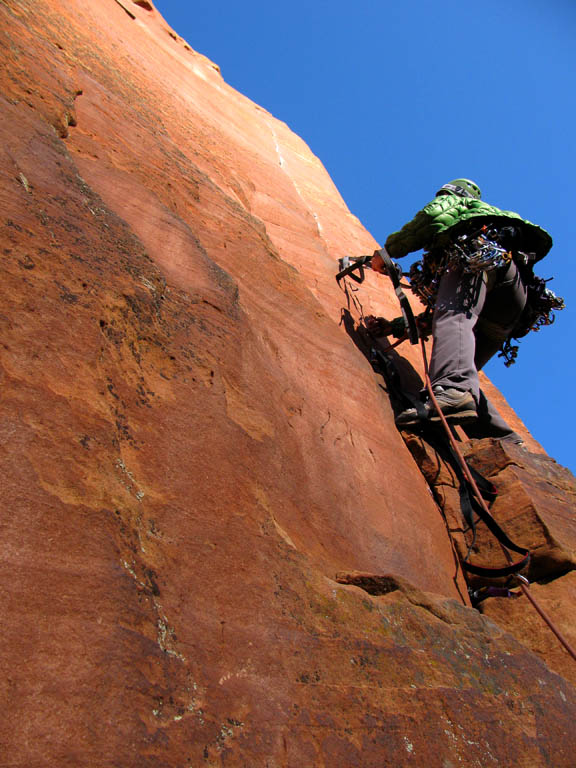 Tammy leading pitch six just as the sun reaches her at 9am sharp. (Category:  Rock Climbing)