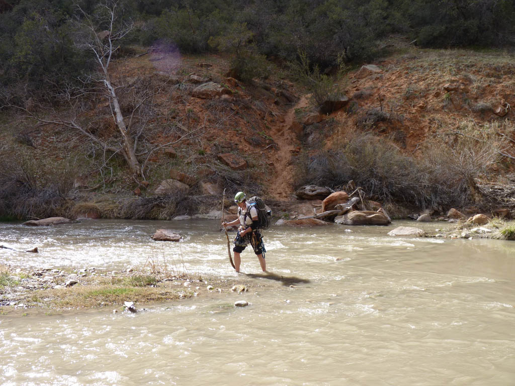 Tammy crossing the Virgin River. (Category:  Rock Climbing)