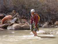 Crossing the Virgin River.  I realize I appear to be slumped in defeat, but I'm just trying to keep my pants from getting wet. (Category:  Rock Climbing)