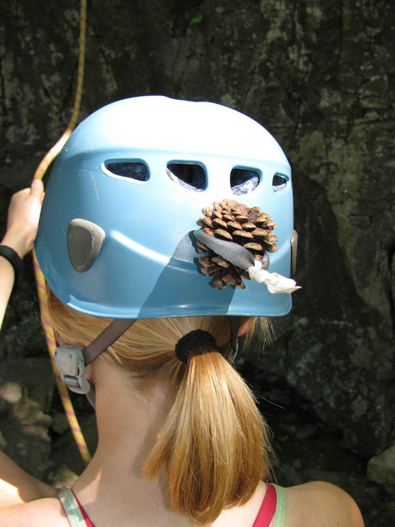 Beth thinks a pinecone will work much better than a stick. (Category:  Rock Climbing)