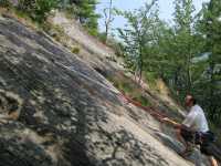 Stick clipping the first bolt on Clip-A-Dee-Doo-Dah. (Category:  Rock Climbing)