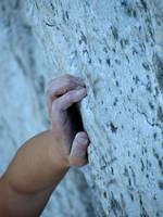 Grabbing one of the small edges at the crux of Arrow. (Category:  Rock Climbing)