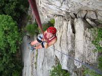 Liz in the middle of the Madame G's hanging rappel. (Category:  Rock Climbing)