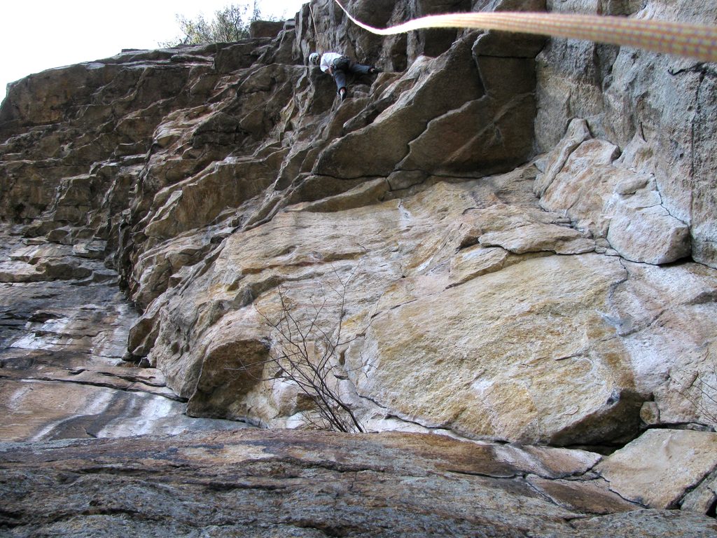 Emily approaching the crux of Feast of Fools. (Category:  Rock Climbing)