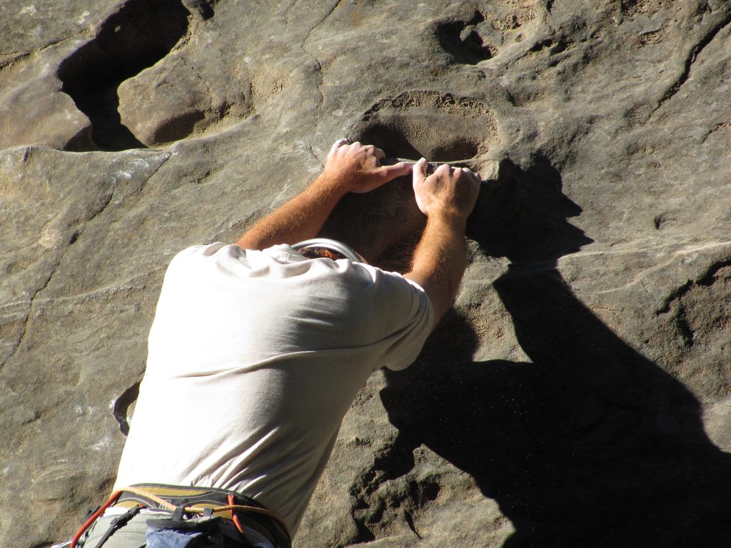 One of the few jugs on this slabby route. (Category:  Rock Climbing, Tree Climbing)