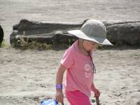 Joelle intently looking for just the right sand to put in her socks. (Category:  Rock Climbing, Tree Climbing)