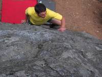 Ben bouldering at Housekeeping boulders. (Category:  Rock Climbing, Tree Climbing)