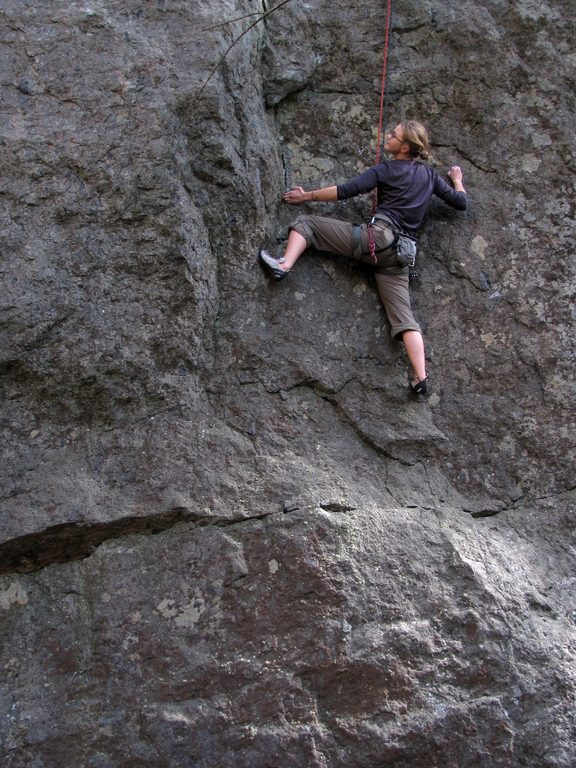 Emily at the crux of James and the Giant Boulder. (Category:  Rock Climbing)