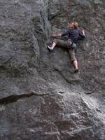 Emily at the crux of James and the Giant Boulder. (Category:  Rock Climbing)