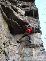 Pulling through the lower roof. (Category:  Rock Climbing)