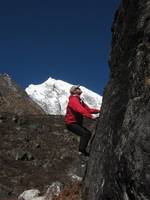 Me bouldering with Langtang Lirung in the background. (Category:  Travel)