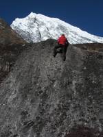Josh bouldering with Langtang Lirung in the background. (Category:  Travel)