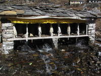 Water powered prayer wheels. (Category:  Travel)