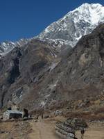 Mani wall with Langtang II in the background. (Category:  Travel)