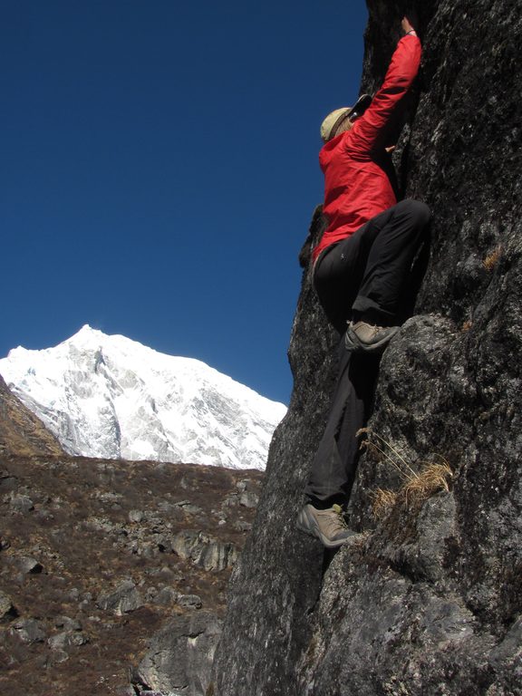 Josh bouldering with Langtang Lirung in the background. (Category:  Travel)