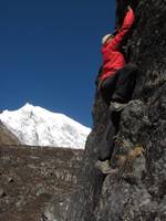 Josh bouldering with Langtang Lirung in the background. (Category:  Travel)