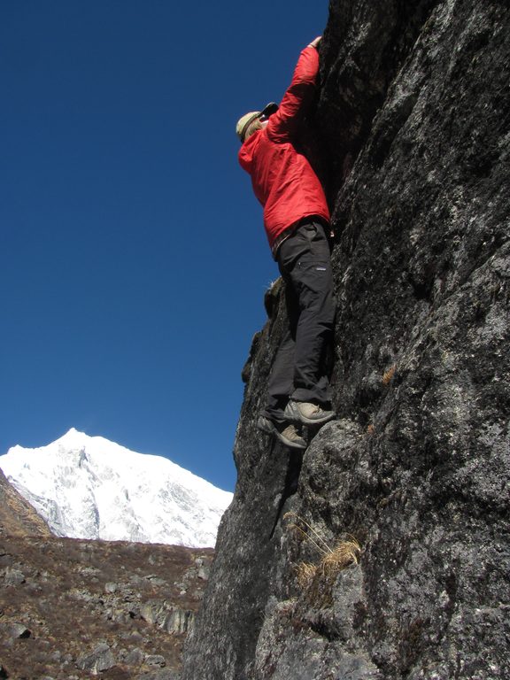 Josh bouldering with Langtang Lirung in the background. (Category:  Travel)