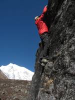 Josh bouldering with Langtang Lirung in the background. (Category:  Travel)