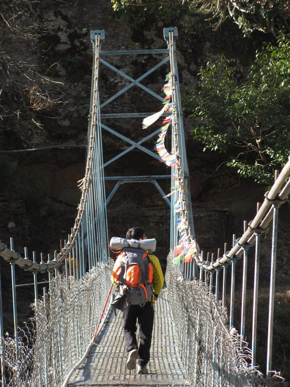 Young crossing a bridge (Category:  Travel)