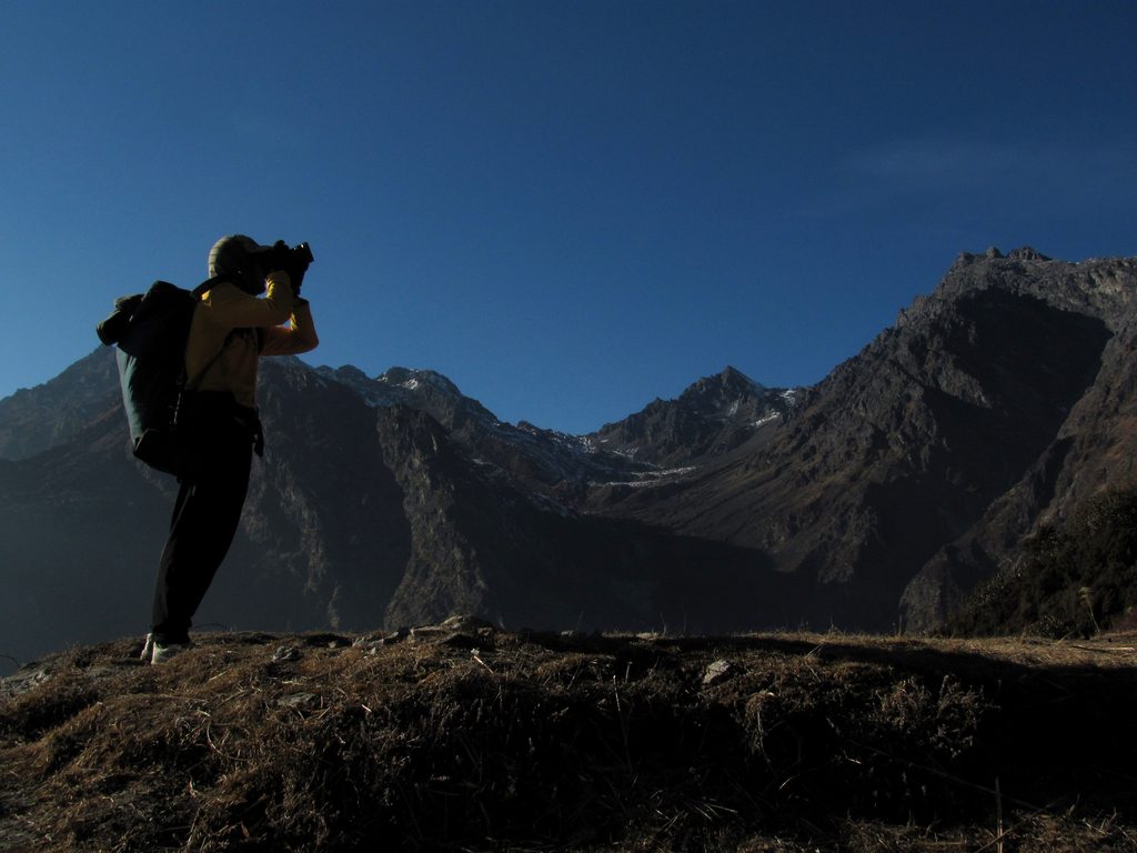 Dave taking photos.  The Laurebina Pass is visible in the center of the photo. (Category:  Travel)