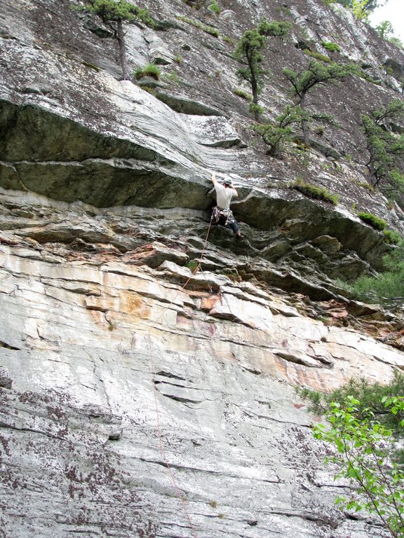 Finally grabbing the jug above the roof. (Category:  Rock Climbing)