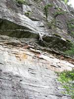 Finally grabbing the jug above the roof. (Category:  Rock Climbing)