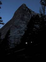 Two headlamps at dawn, with Charlotte Dome in the background. (Category:  Rock Climbing)