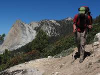 Mike hiking out with Charlotte Dome in the background. (Category:  Rock Climbing)