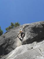 Setting up for the crux mantle move on Nutcracker. (Category:  Rock Climbing)