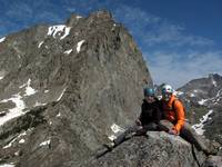 Beth and Mike on the summit of Sundance Pinnacle. Warbonnet towering in the background. (Category:  Rock Climbing)